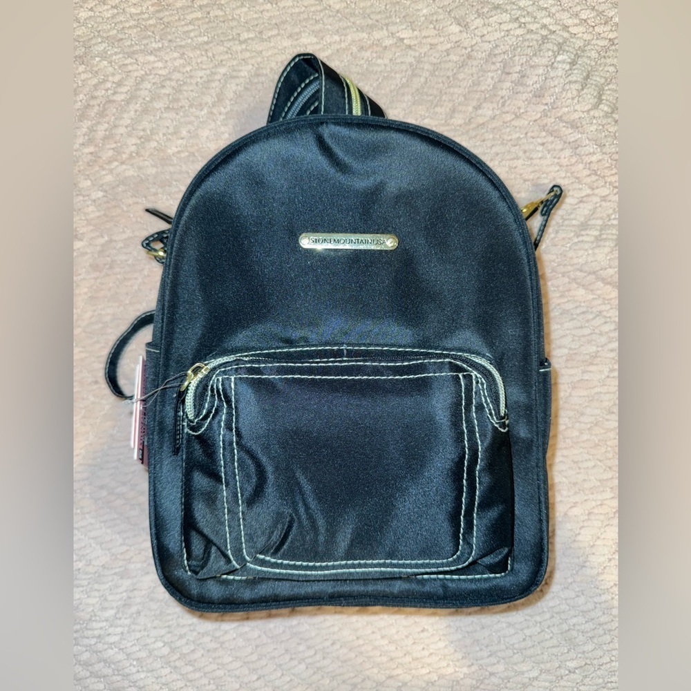 Stone Mountain five Way Backpack with Gold Accents. Adjustable straps. NWT